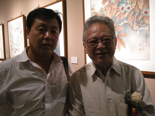 《艺术天成》杂志社总编杨文超与著名画家姚治华合影