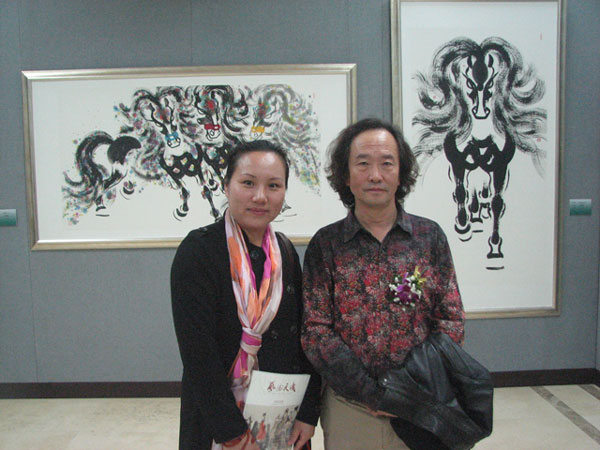 著名画家郭振乾与《艺术天成》通联部主任宁文艳合影